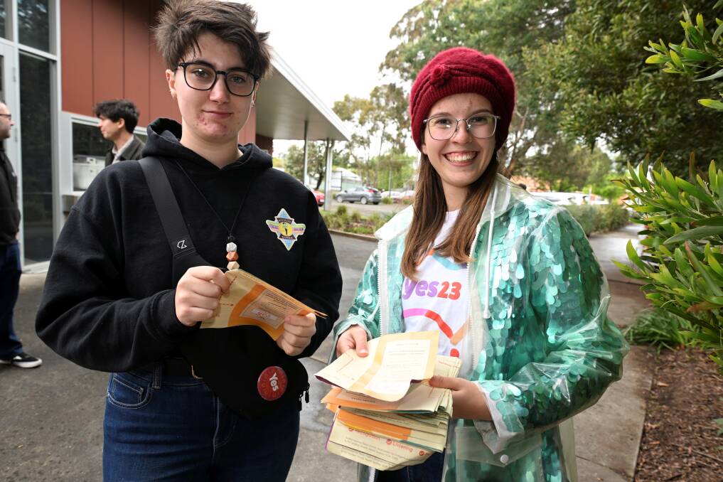 Trillian Sharples and Bindi Phillips were dancing to stay warm while handing out fliers at Ballarat North Primary School. Picture by Lachlan Bence