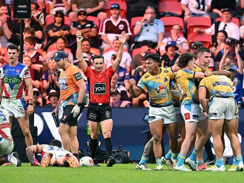 Titans players celebrate Brian Kelly's try that was later overturned by the Bunker. (Dave Hunt/AAP PHOTOS)