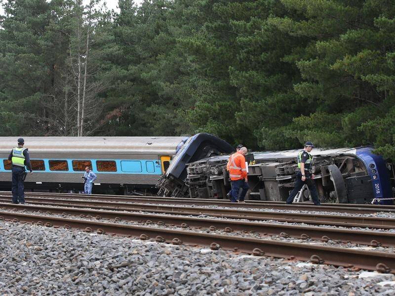 Driver John Kennedy and rail worker Sam Meintanis were killed in a derailment near Wallan. (David Crosling/AAP PHOTOS)